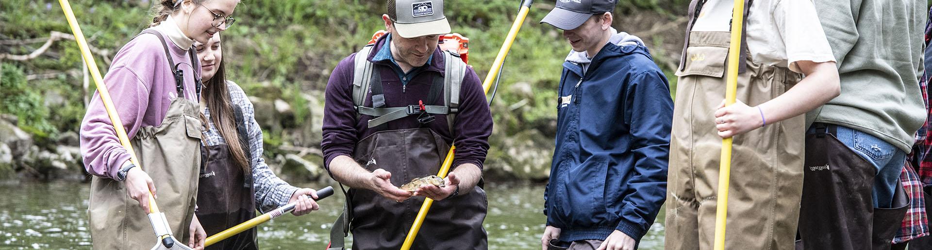 Dr. Mark Gathany teaching environmental science students in outdoor laboratory.